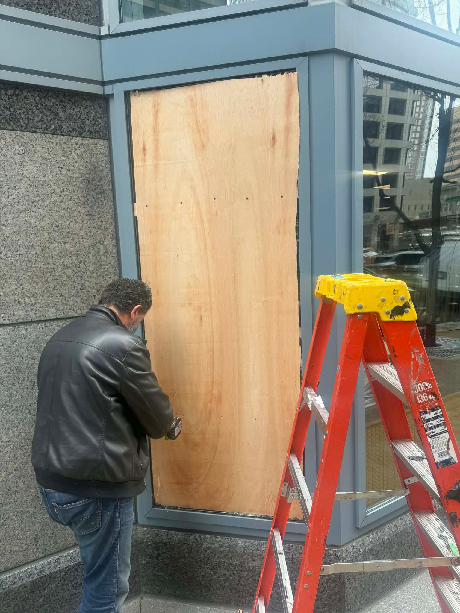 Broken storefront opening before emergency board-up